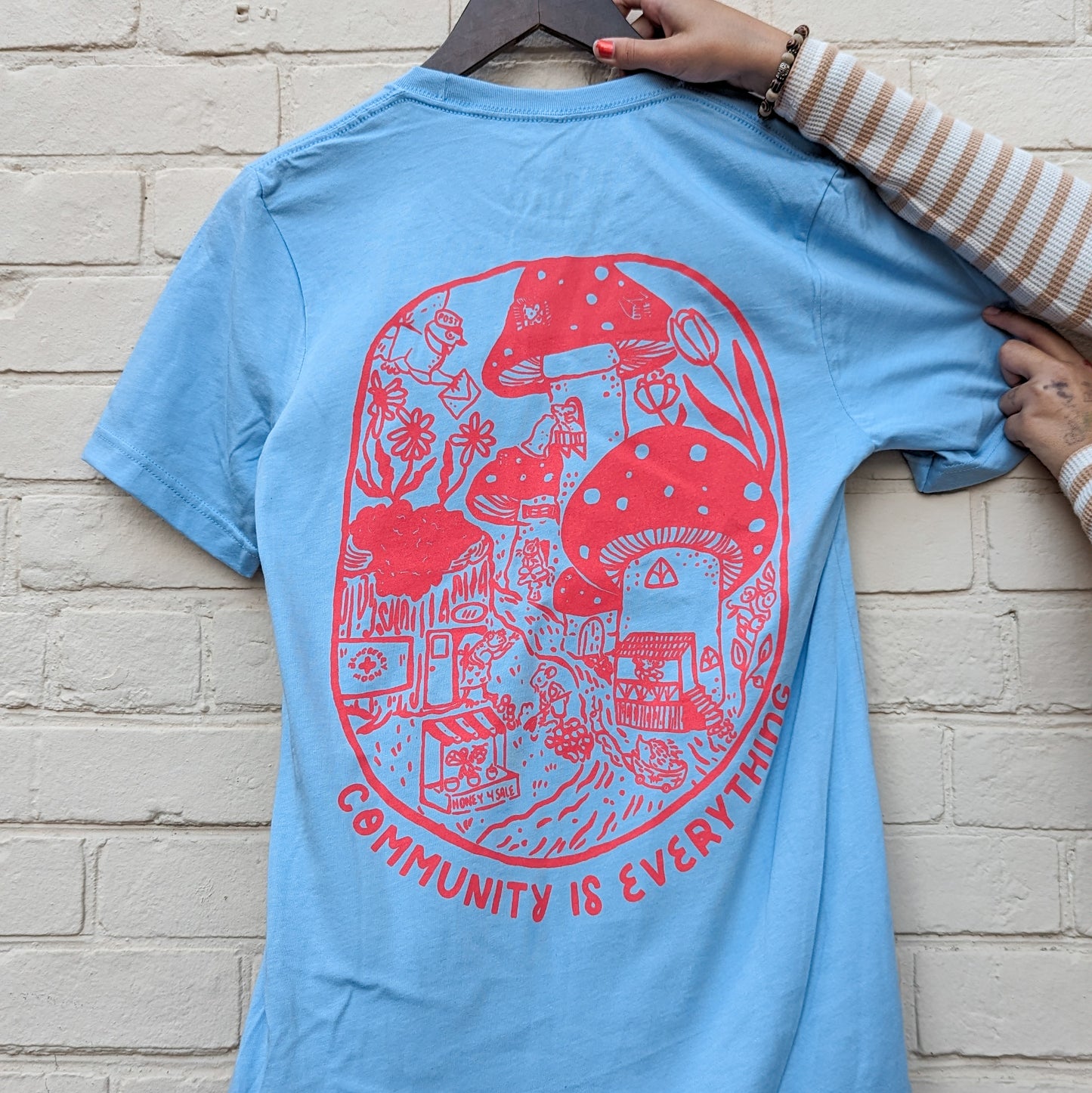 "Community Is Everything" Light Blue T-Shirt