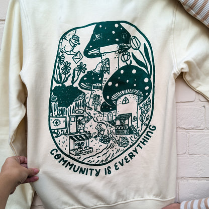 "Community Is Everything" Ivory Crewneck Sweater
